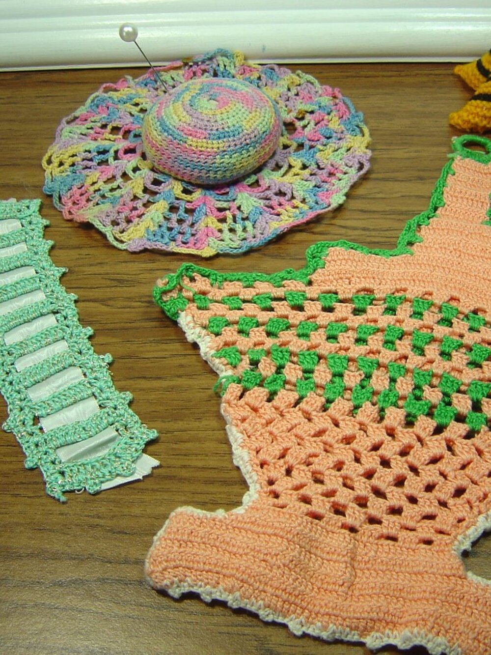 Lot of 4 vintage hand made crocheted items-pincushions, basket & book marker